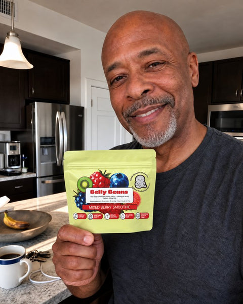 Customer holding a Belly Beans pouch at his kitchen island