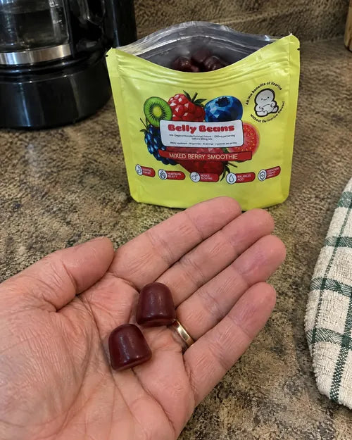 Two gummies in an open palm