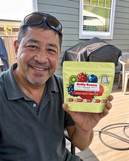 Customer holding a Belly Beans pouch on his porch